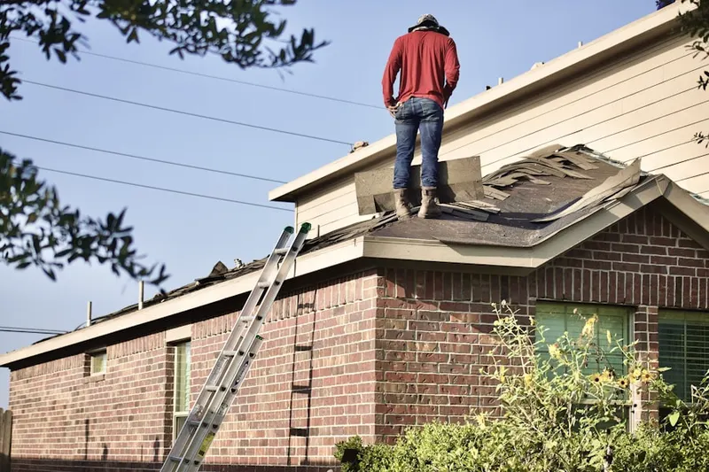 Professional roofer working on a residential roof in Montecito Heights
